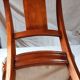 2 varnished solid wood chairs with "ethnic" padding