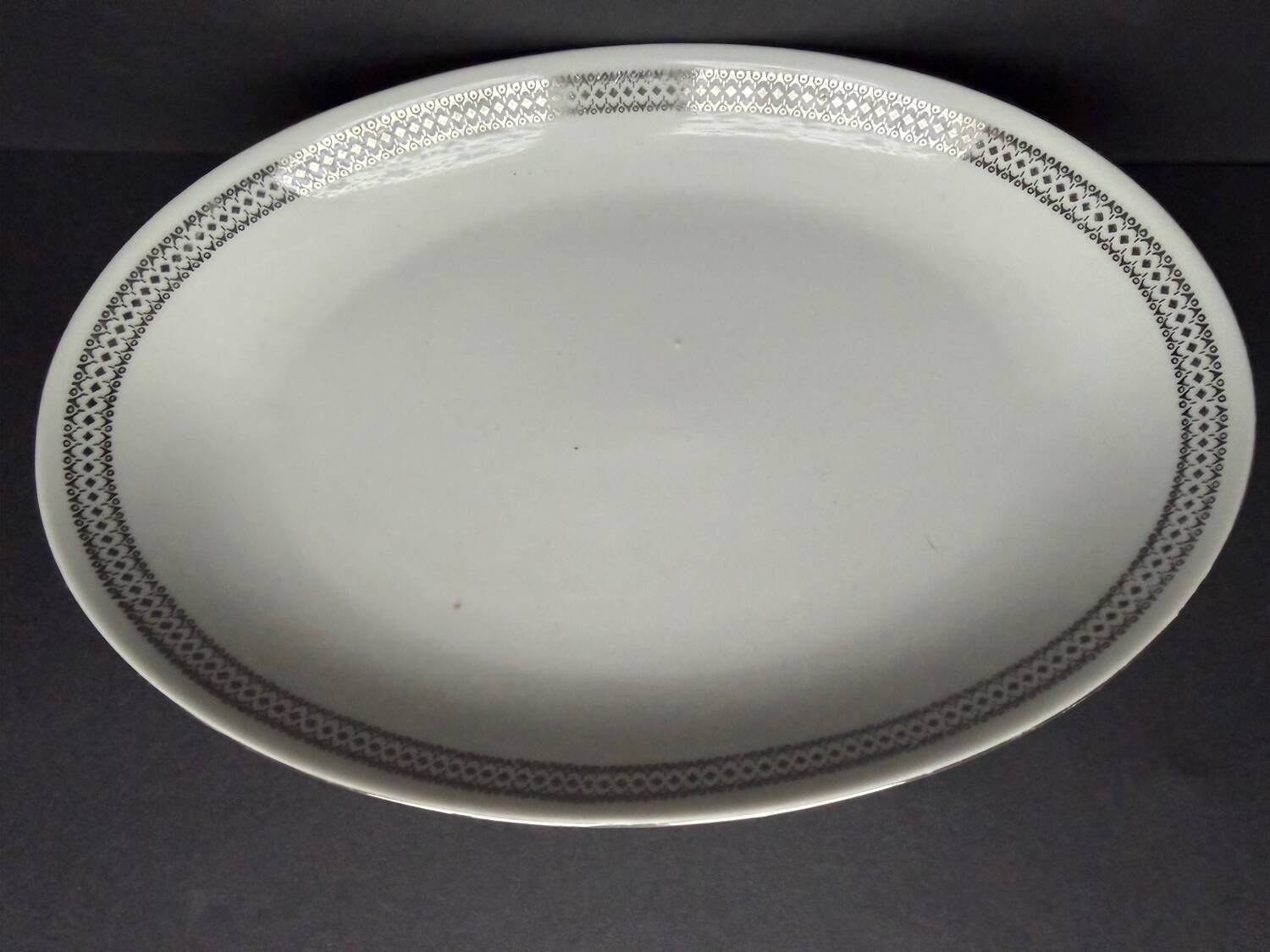 4 small oval porcelain dishes