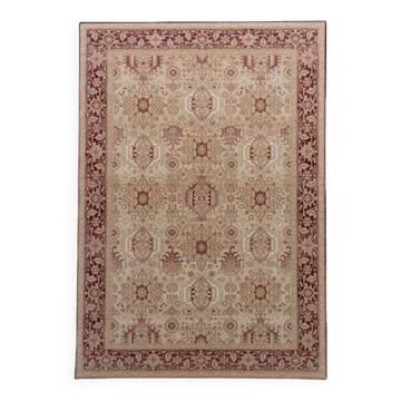 Beige and red oriental rug in wool