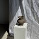 Small brutalist handcrafted terracotta vase with a pedestal, Indonesian, H19 D17.