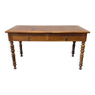 Cherry wood desk with a leather top.