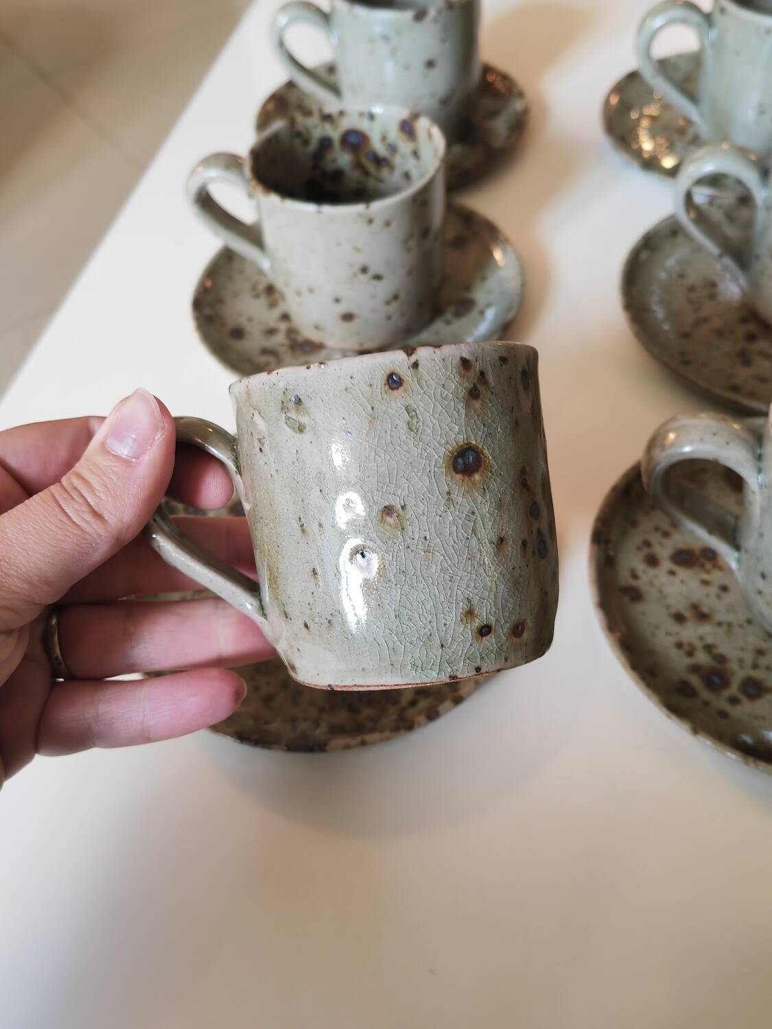 Series of stoneware cups and saucers