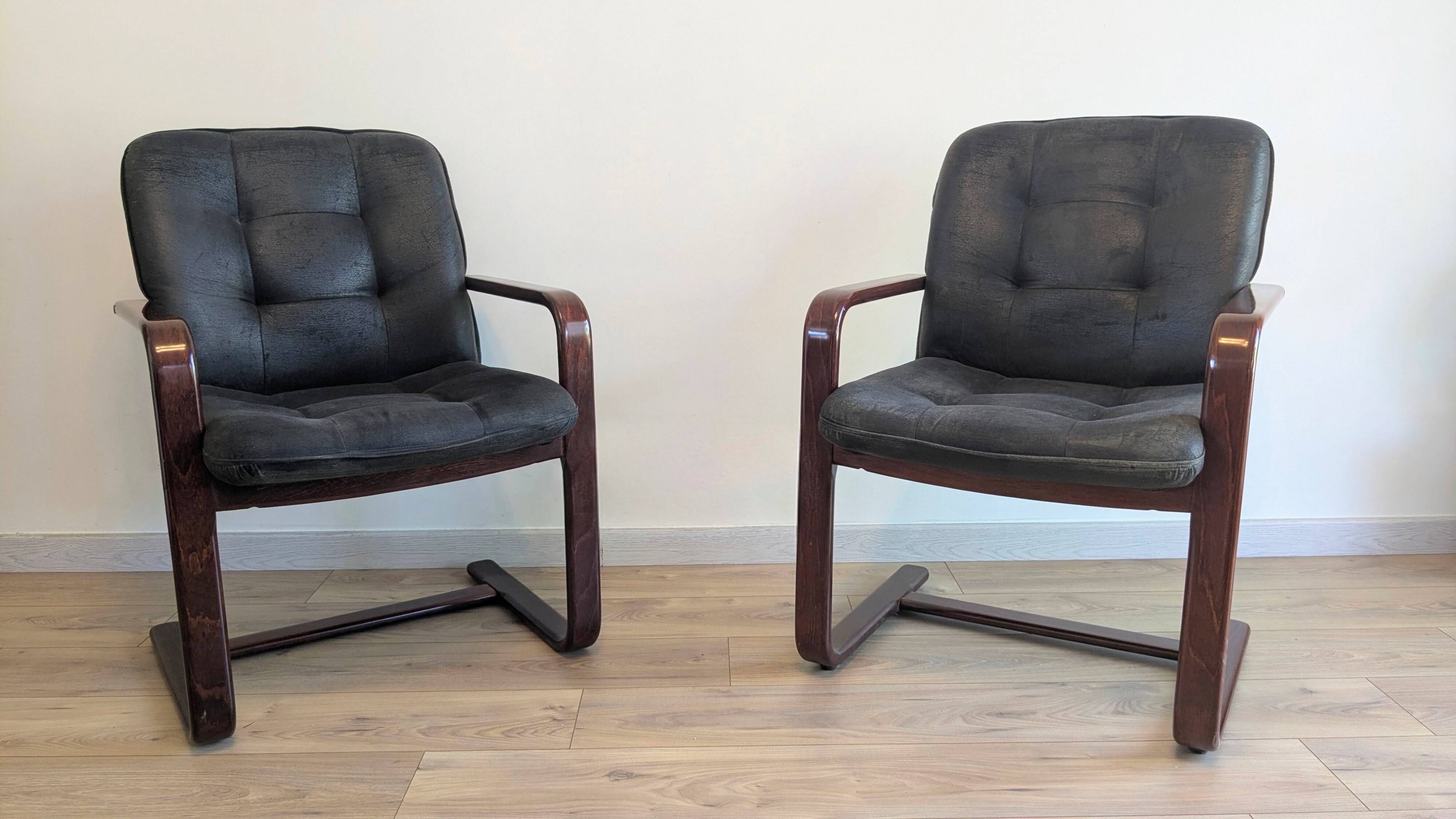 Pair of vintage cantilever armchairs in rosewood veneer.
