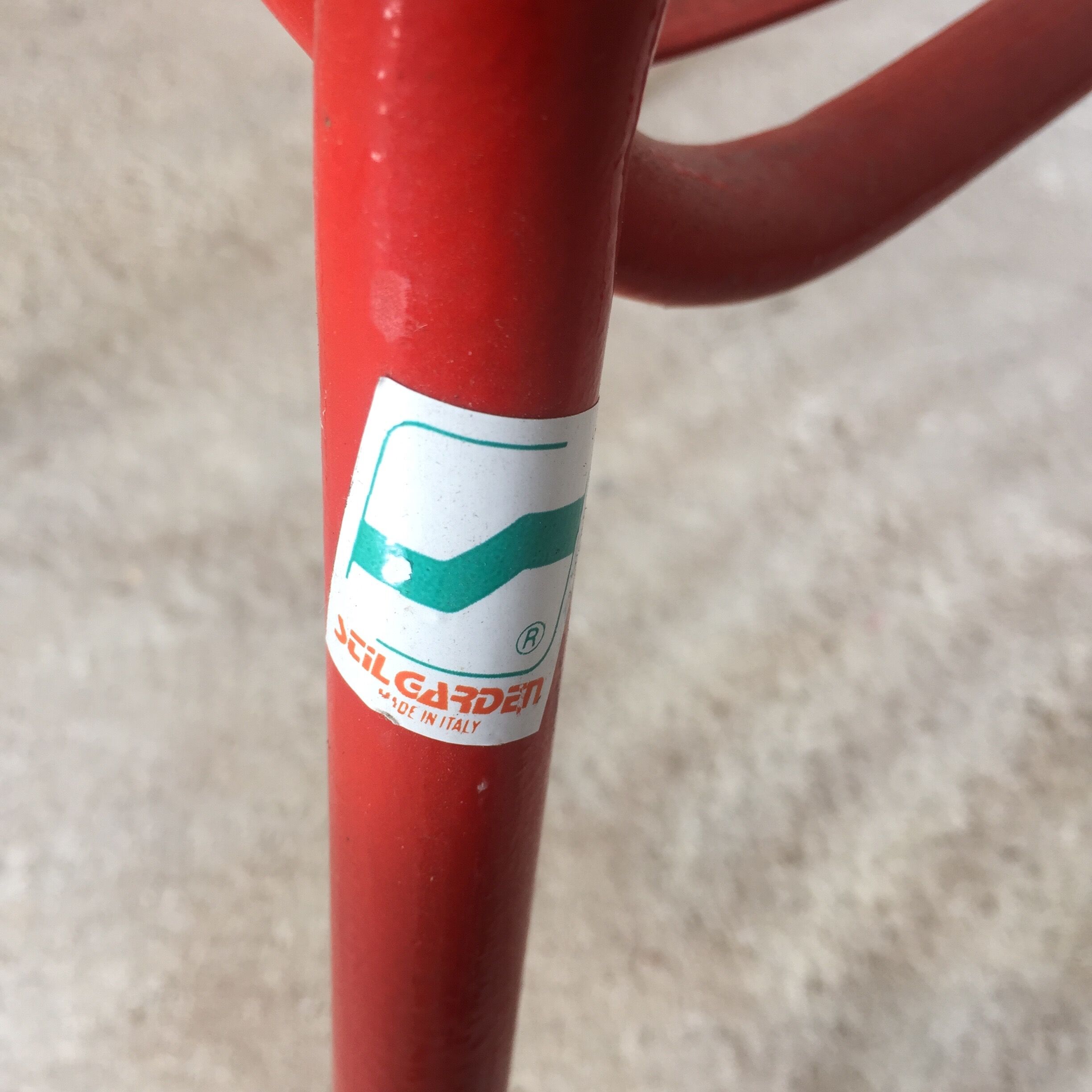 1960s red metal chair published by Stil Garden