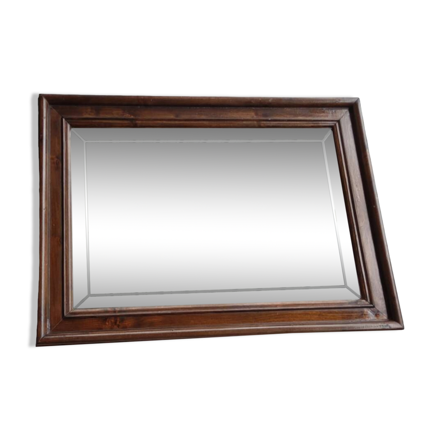 Old beveled mirror with wooden frame