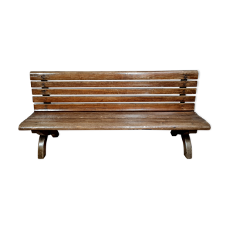 Park bench and garden with natural wood backrest xixth century