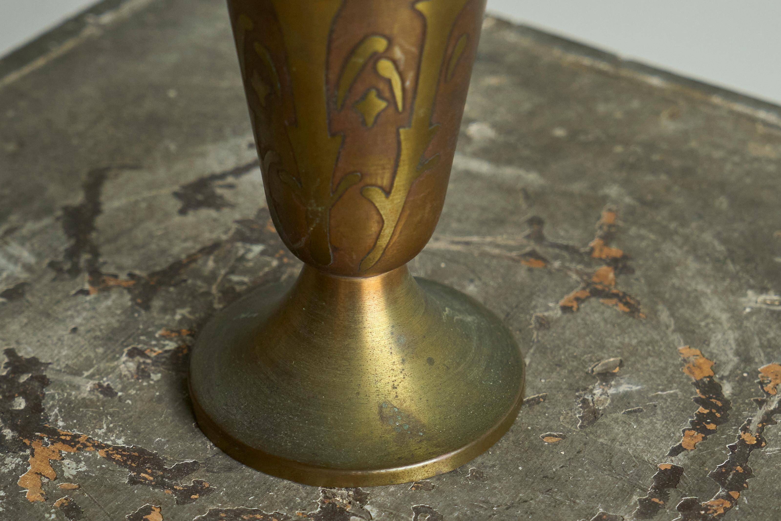 Art Deco fluted vase in patinated metal and brass from the 1930s.