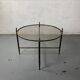 Round coffee table in brass and smoked glass