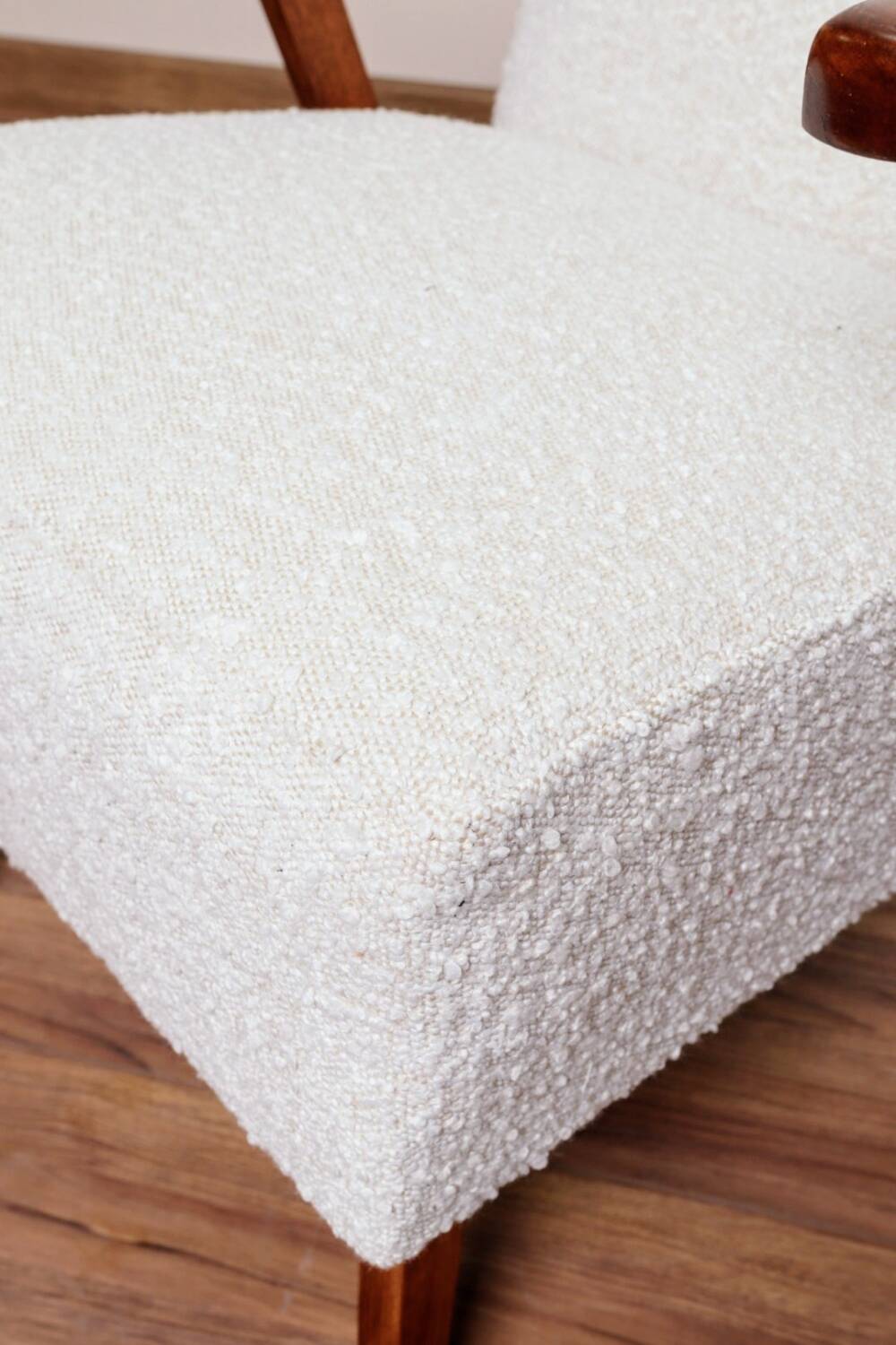 Vintage armchair in pearl bouclé, mid-century modern design from the 1960s.