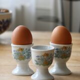 Vintage white porcelain egg cups with floral pattern