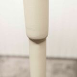 Parrot wears white Baumann coat 1970