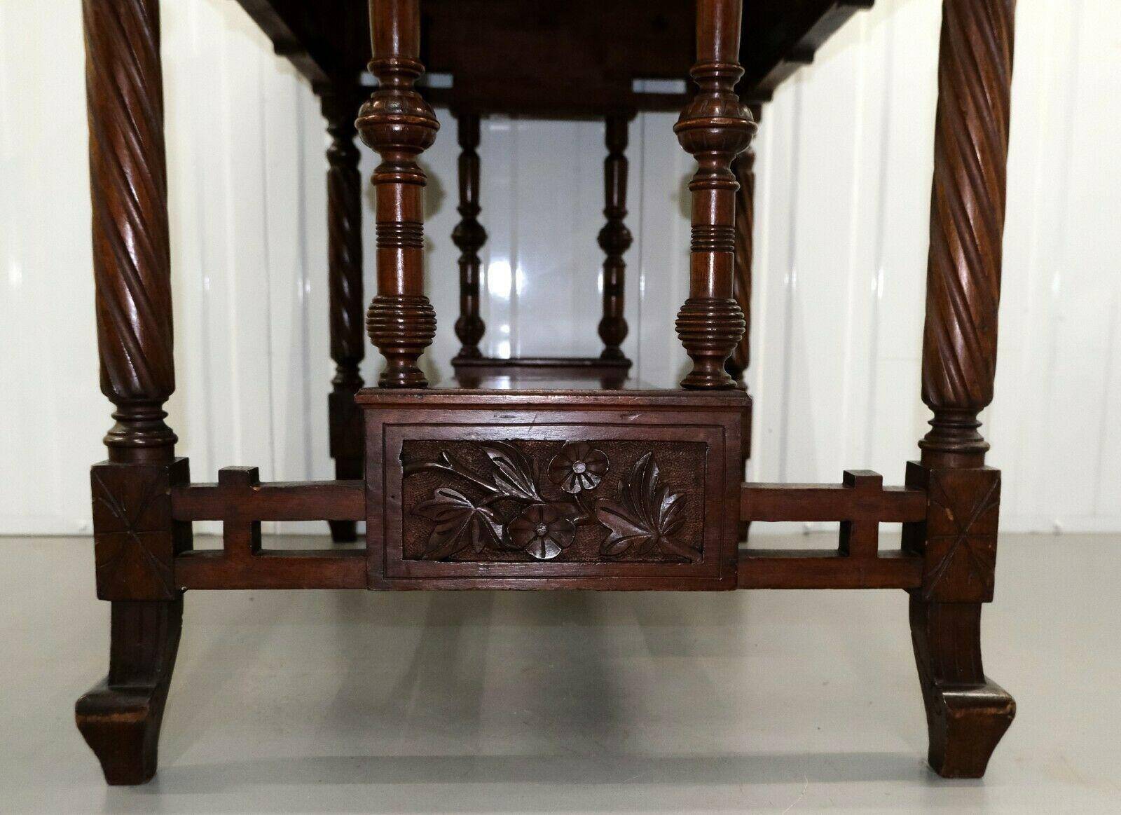 19th-century carved walnut desk with a leather top.