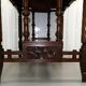 19th-century carved walnut desk with a leather top.