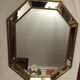 Miroir octogonal en bois doré biseauté  92x71cm