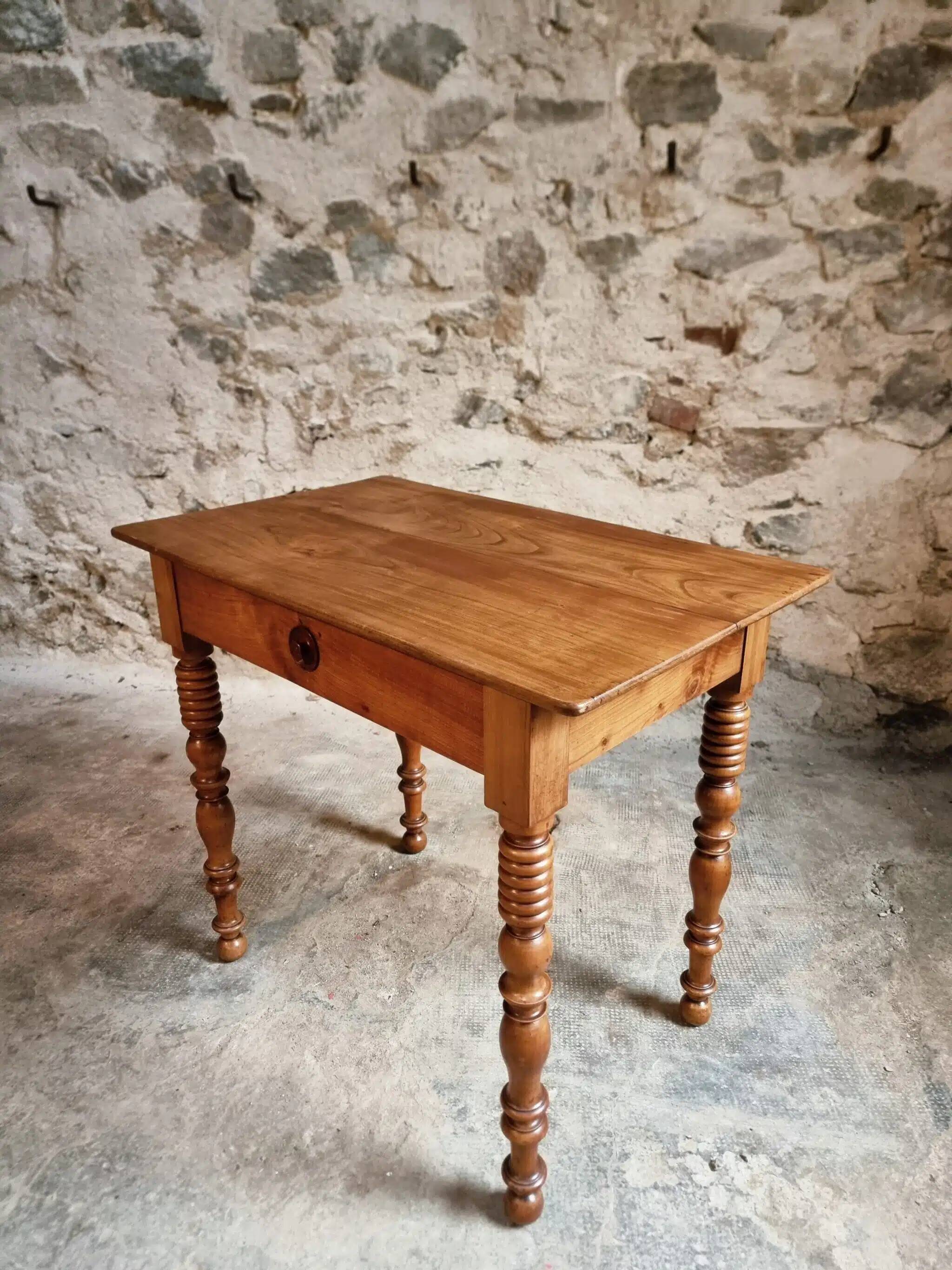 Small antique French writing table in walnut with a drawer, around 1900.