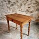 Small antique French writing table in walnut with a drawer, around 1900.