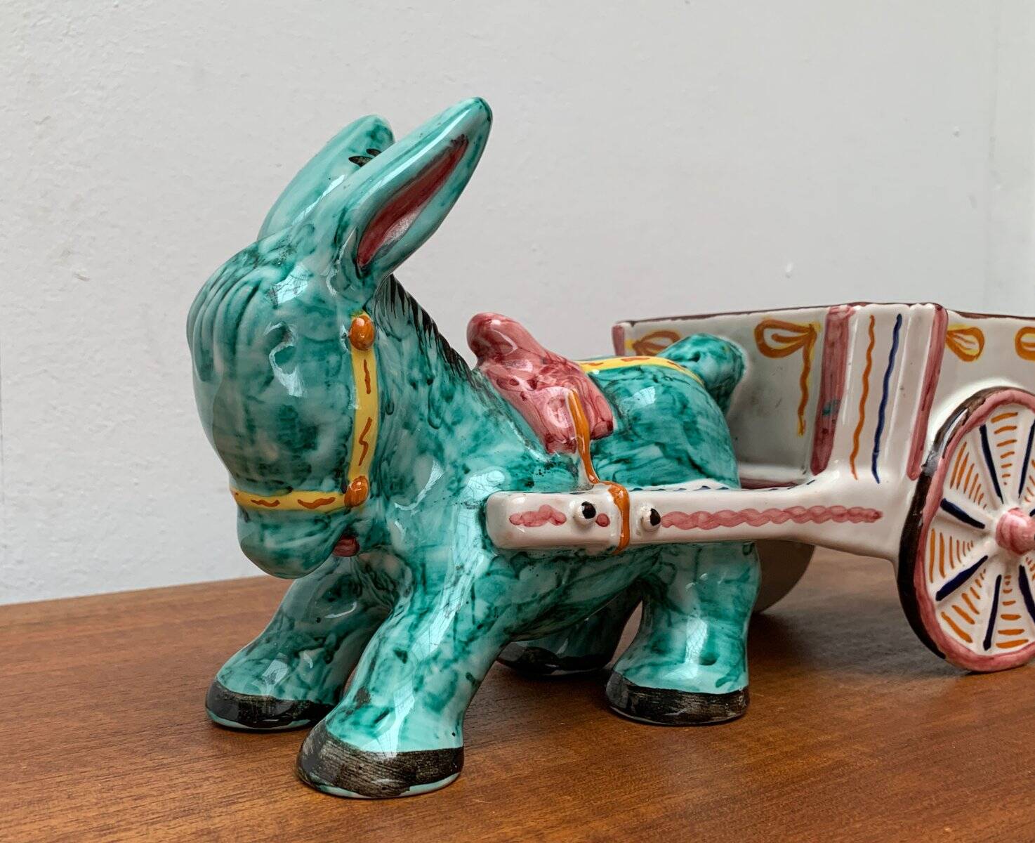 Vintage Italian hand-painted sculpture of a donkey with a cart in the shape of a bowl from Deruta, Italy.
