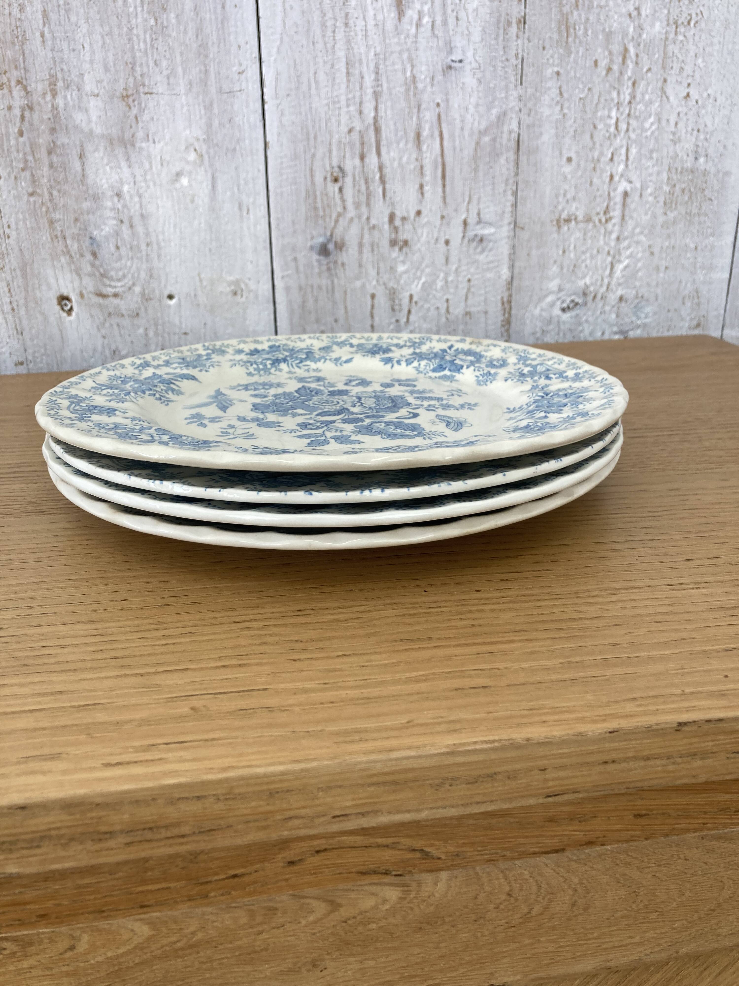 Four old blue plates