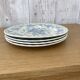 Four old blue plates