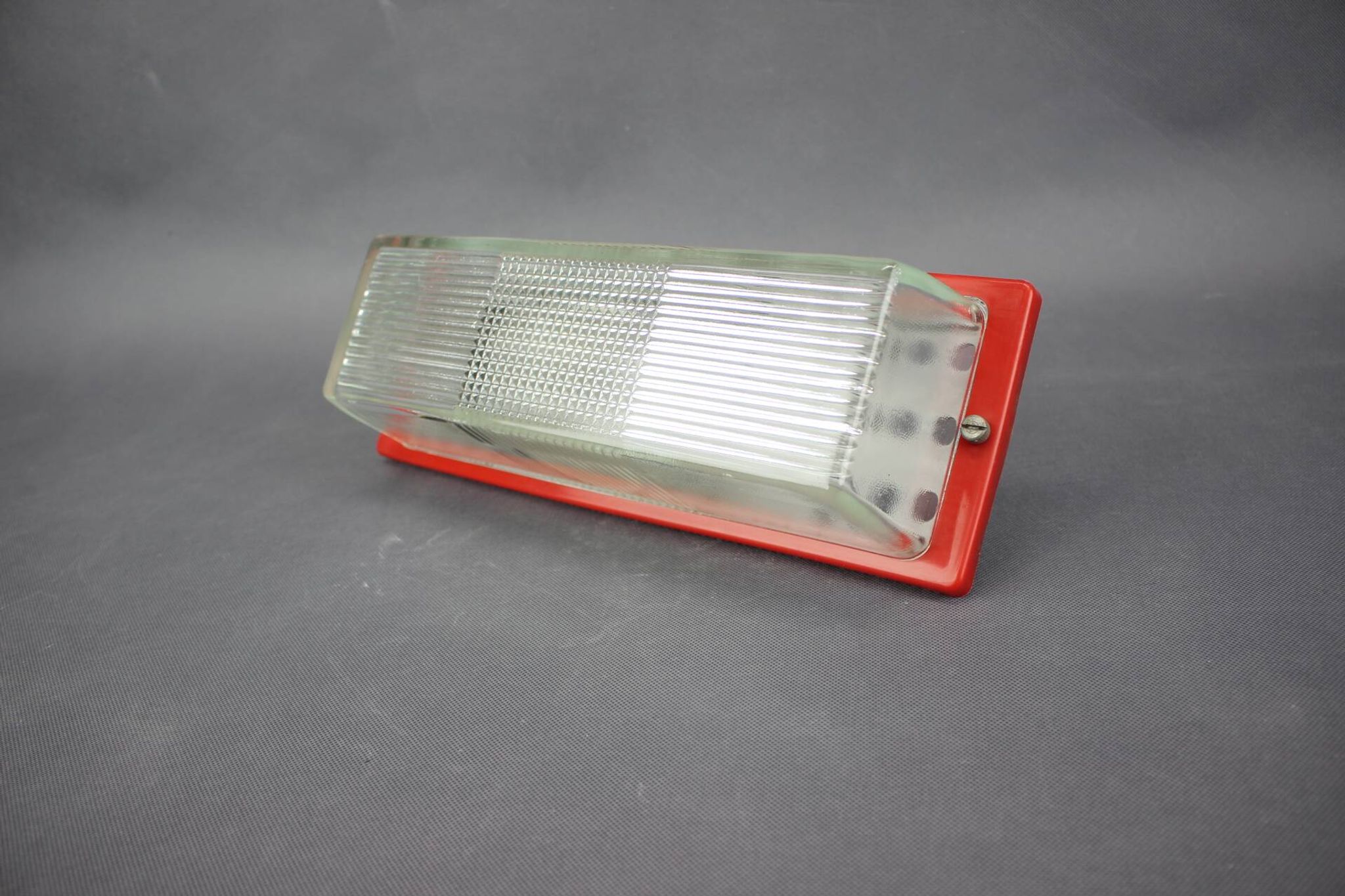 1970s Czech space age wall light with red plastic and glass.