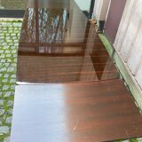 Scandinavian extendable dining table made of solid wood and rosewood effect.