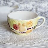 Large vintage earthenware mug with fruit motif and slip details