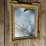 Miroir en bois et stuc doré