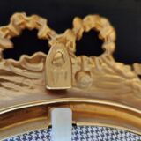 Louis XVI mirror in gold resin decorated with knots 44x62cm