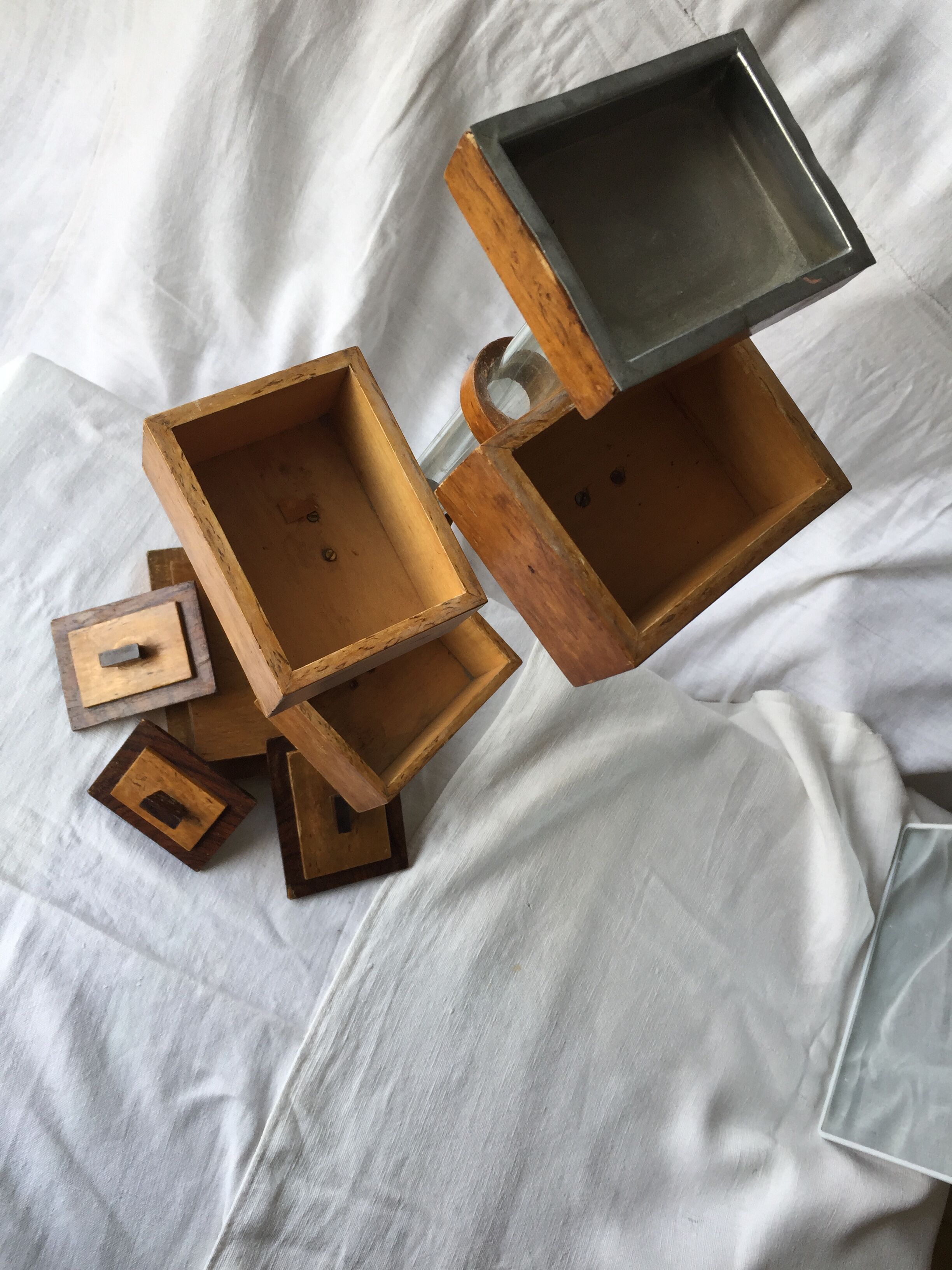 Small 1930s wooden and glass furniture with sliding storage boxes
