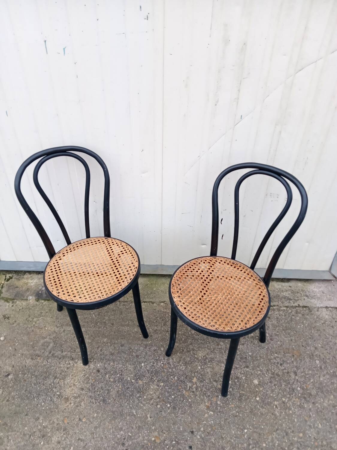Pair of fmg bentwood and cane bistro chairs