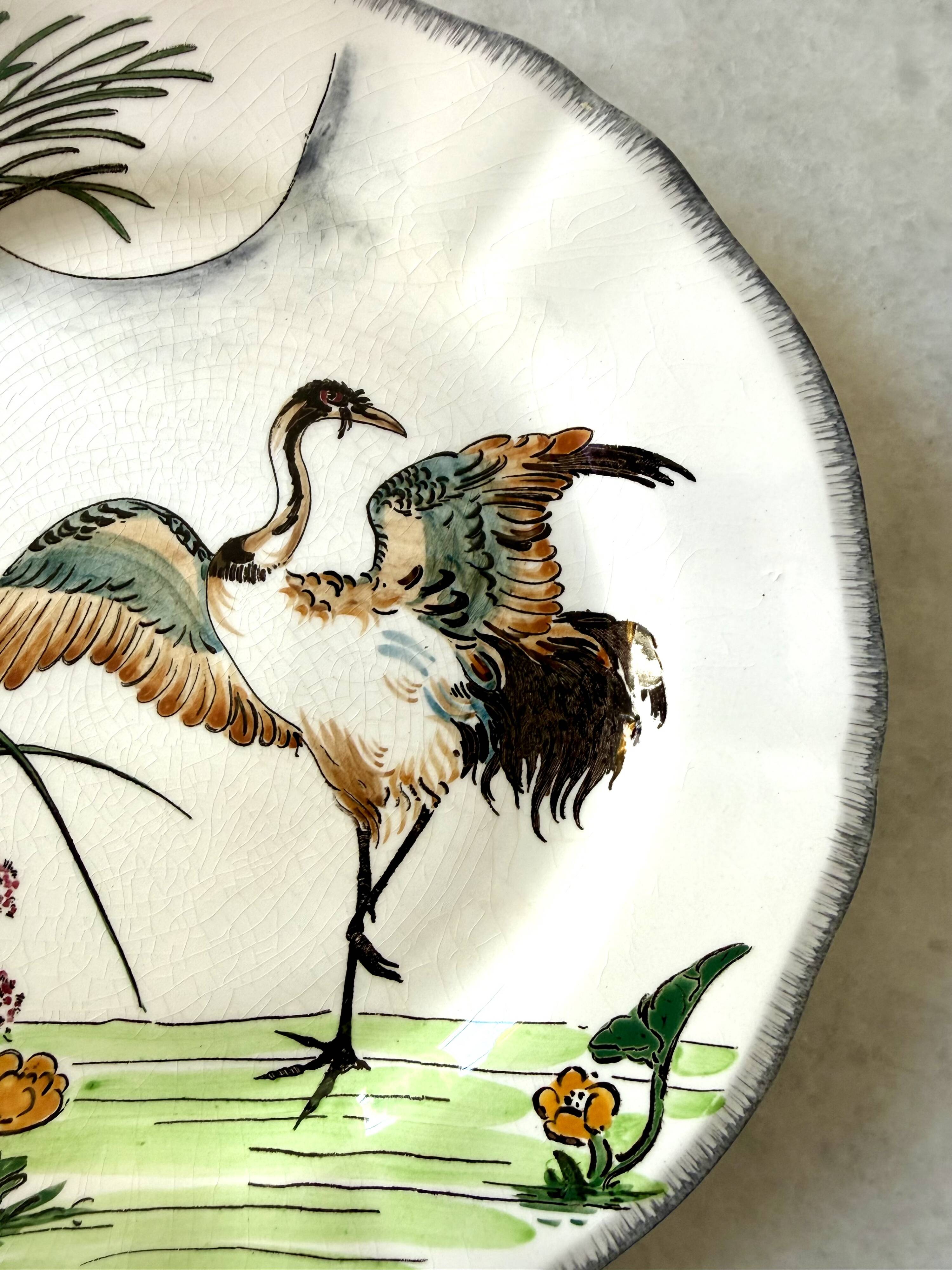 Service de table assiettes et plats Gien modèle grands oiseaux