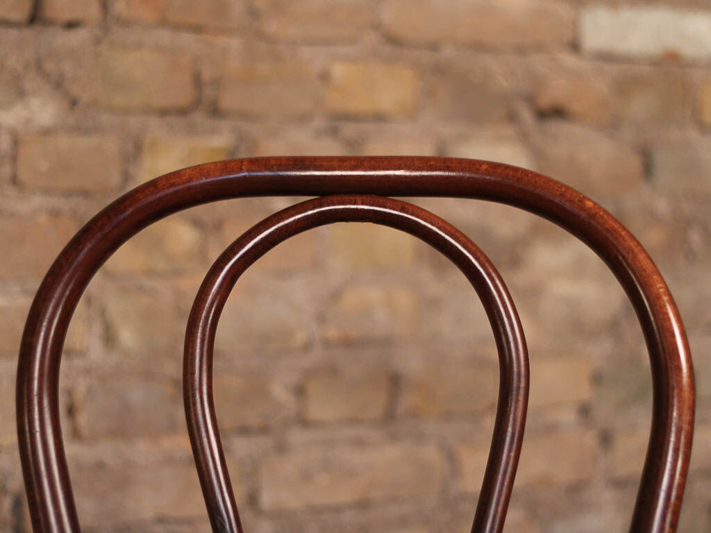 Curved wooden chair and tuna-