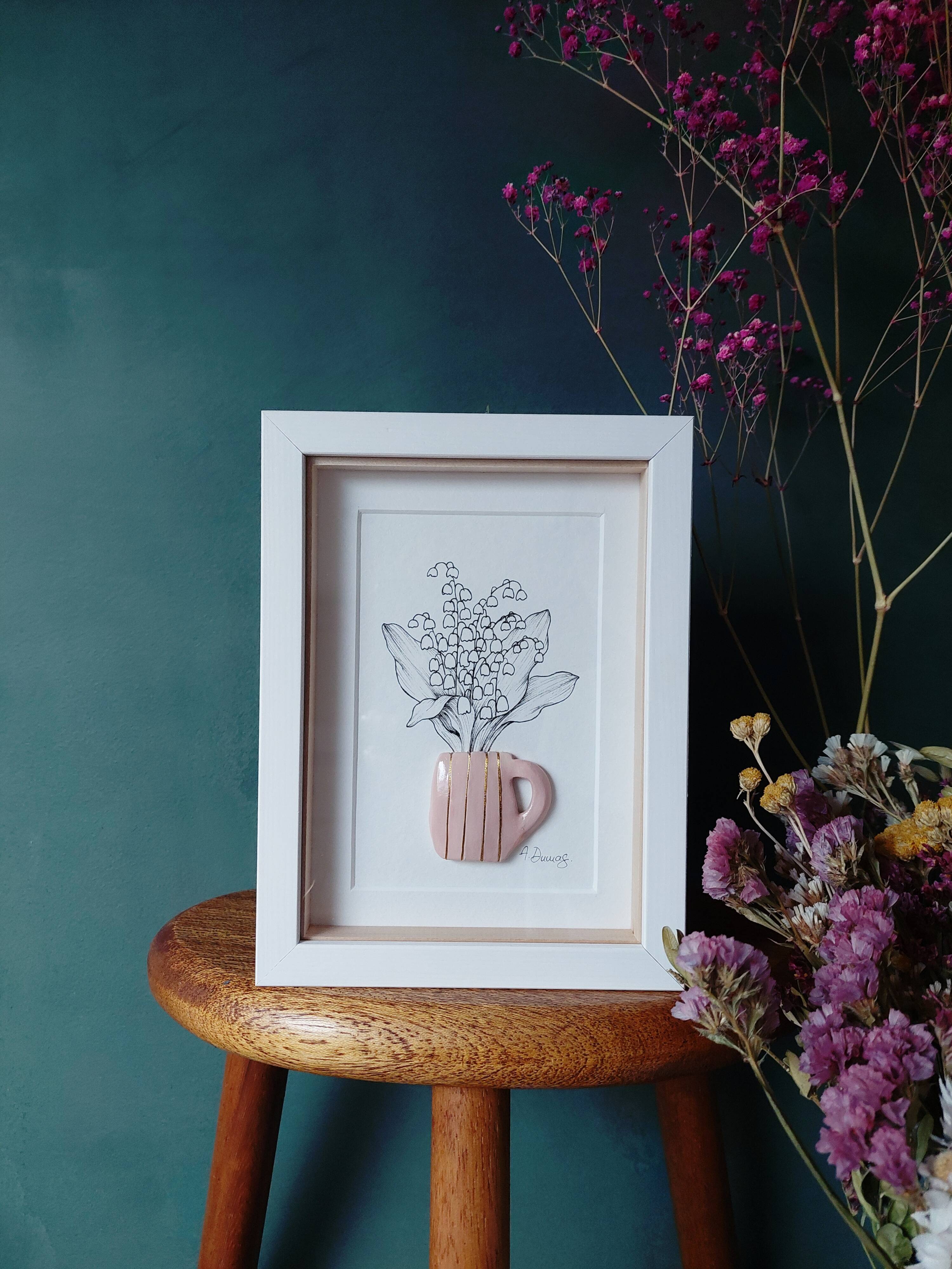 Composition of a bouquet of lily of the valley in a clay mug