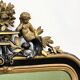 Antique 1800s black and gold mirror with cupid, France 1800s.