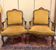 Pair of faux Louis XV armchairs in fully carved walnut