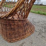Old throne basket armchair in woven wicker