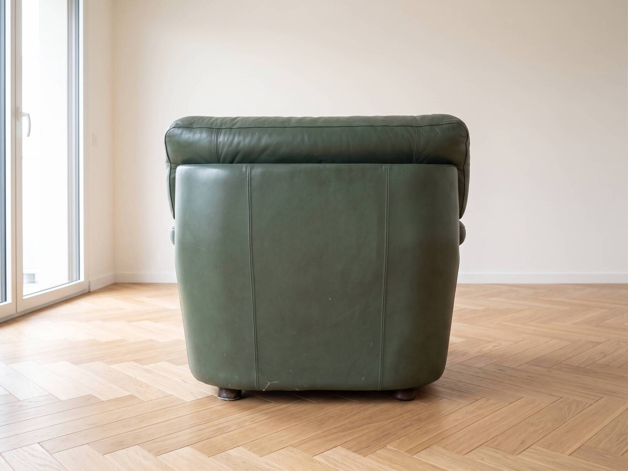 Vintage green leather armchair