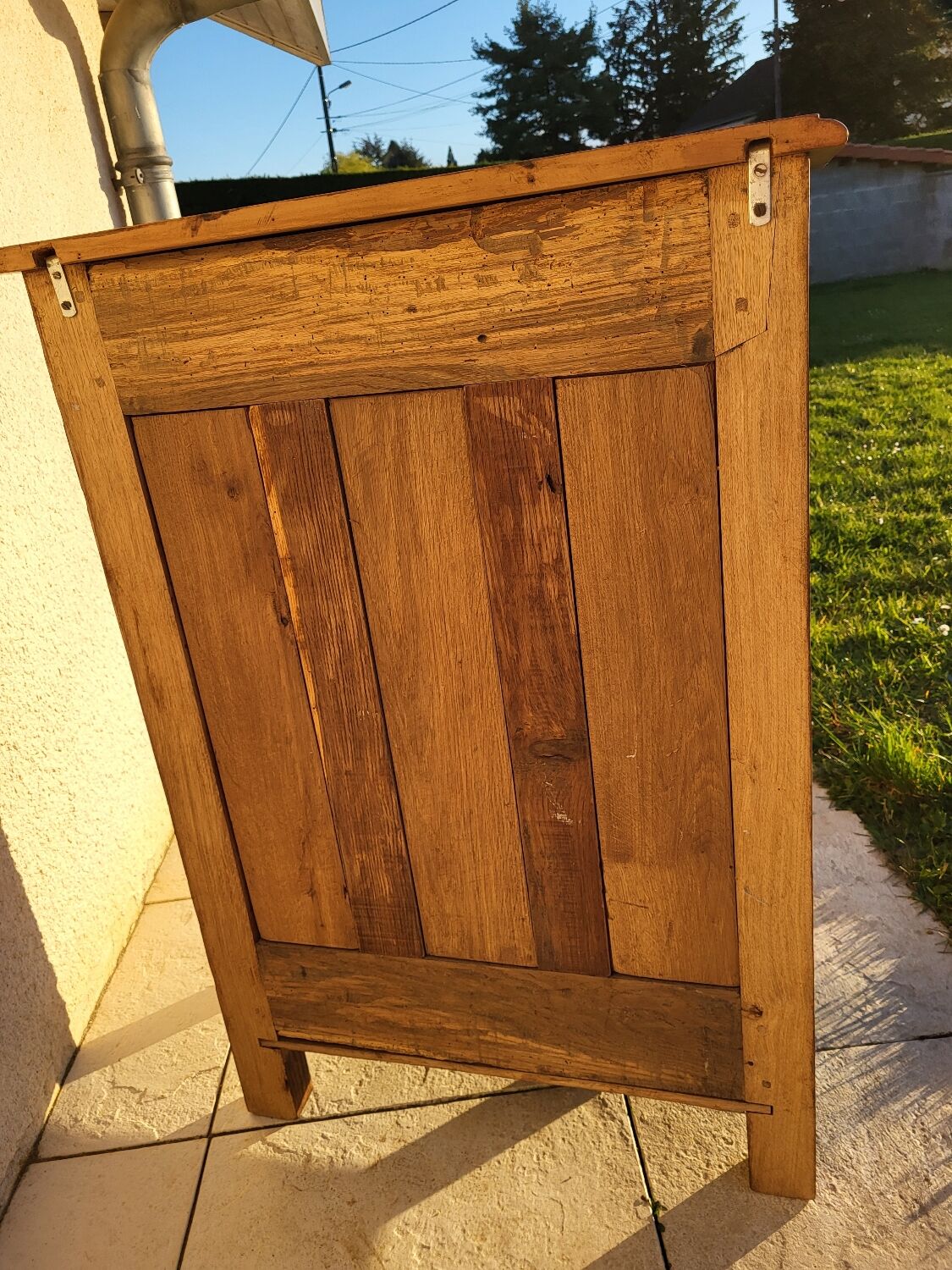 Furniture with a cherry wood door.