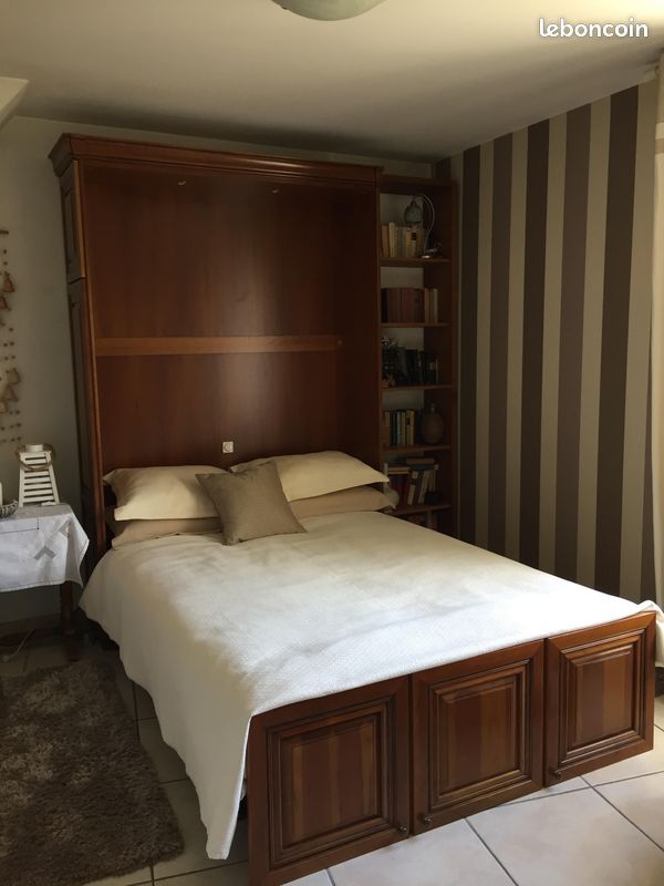 Electric retractable bed cabinet