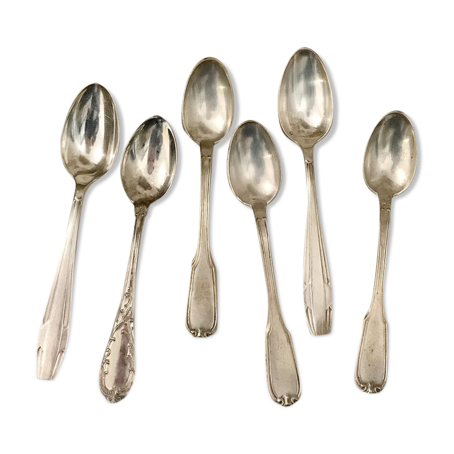6 mismatched silver spoons