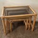 Trio of vintage pull-out tables in rattan and smoked glass 70s