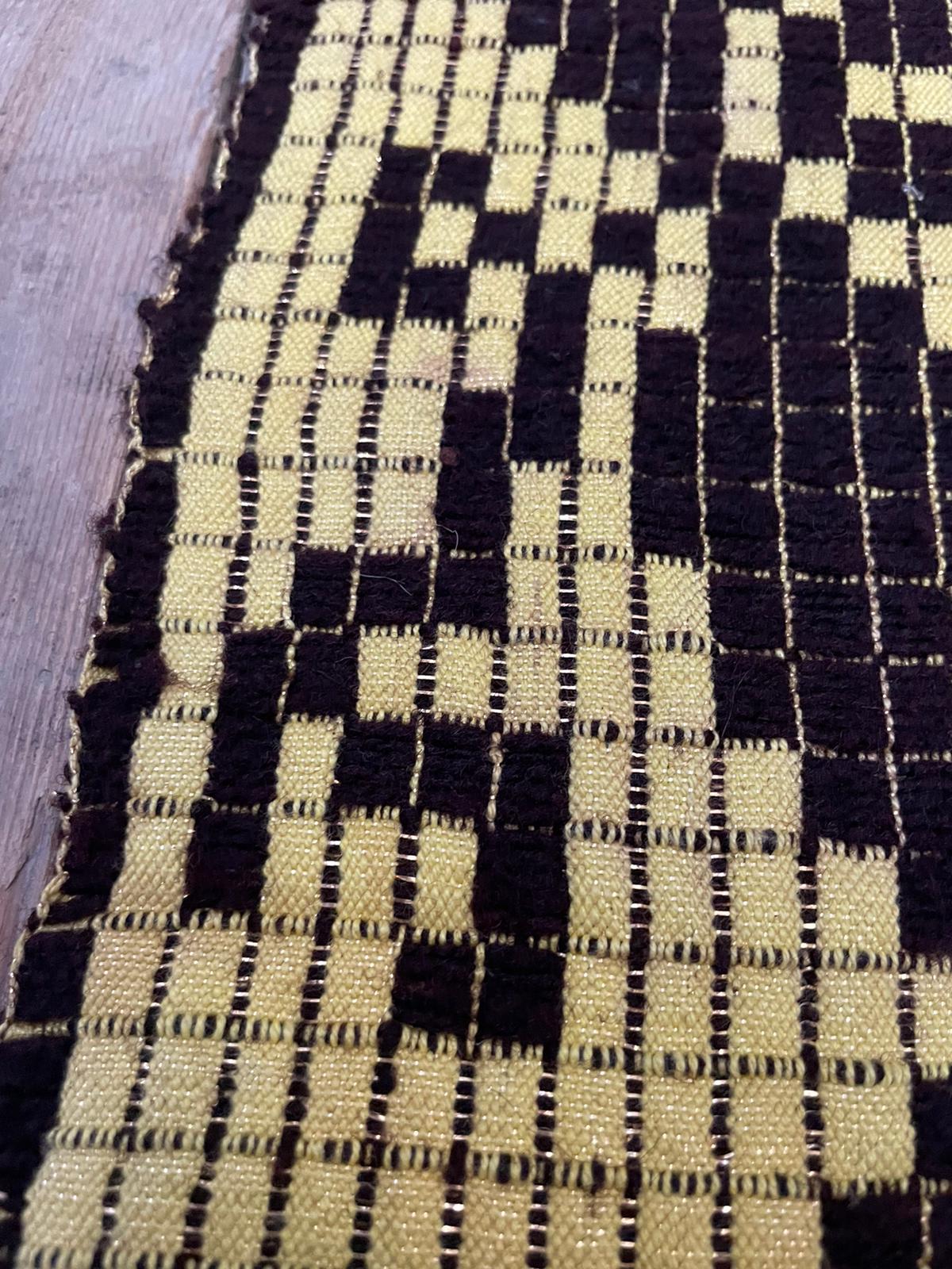 Romanian floral rug handwoven in wool, yellow and black background