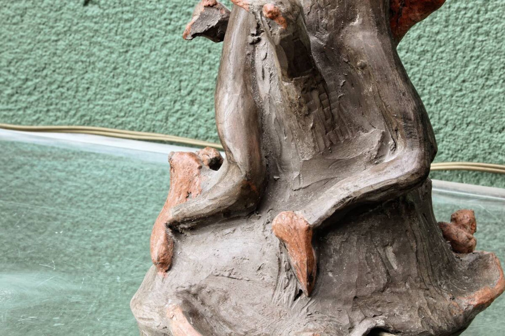 Lamp base in sculpted terracotta featuring birds, signed.