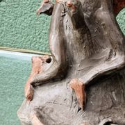 Lamp base in sculpted terracotta featuring birds, signed.