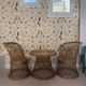 Table and two wicker chairs for children.