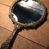 Antique mirror facing round hand in bronze 23cm
