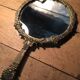 Antique mirror facing round hand in bronze 23cm