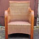 Fauteuil esprit colonial, bois et rotin, accoudoirs