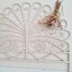 Peacock headboard in white rattan