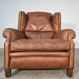 Beautiful pair of wide leather club armchairs with ears in Havana colour.